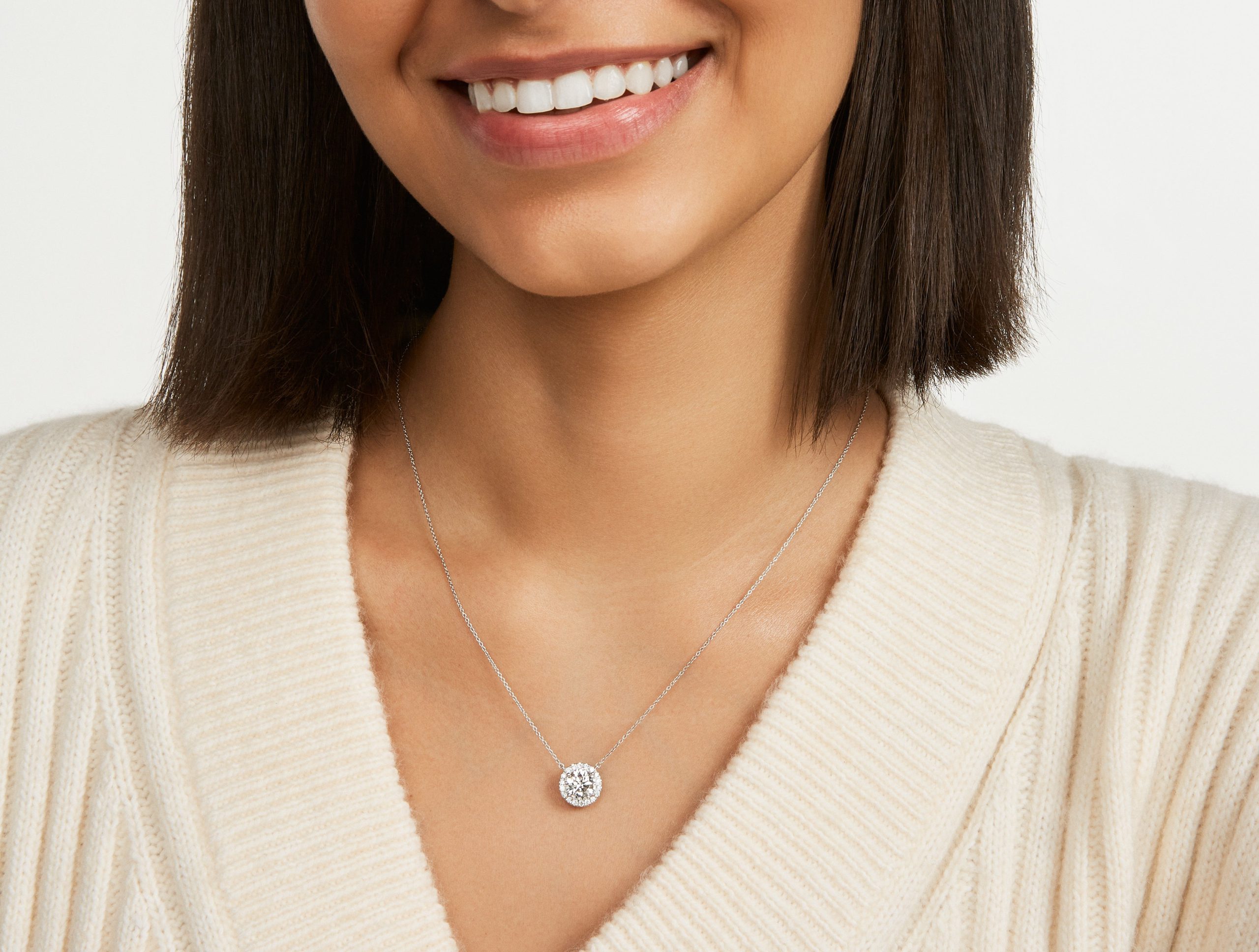PD110128-white-2ct-halo-pendant-Medium_Skin_1.jpg
